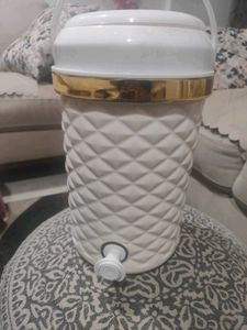 Elegant Water Dispenser with Gold Trim