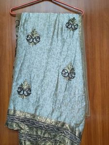 Khaki Embroidered and sequin silk net Saree