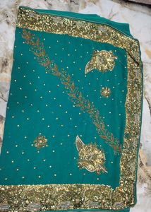 Teal Saree with Intricate Gold Embellishments