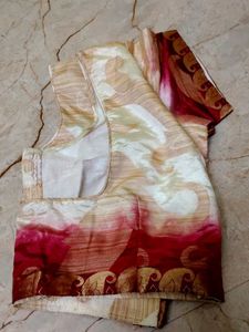 pink border with a cream colour blouse