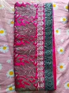 Elegant Pink Saree with Intricate Detailing
