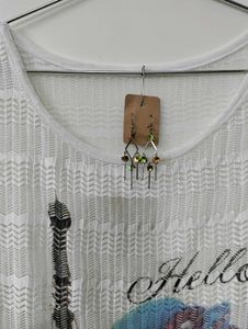 Eiffel Tower Graphic Top with Shiny Earrings.