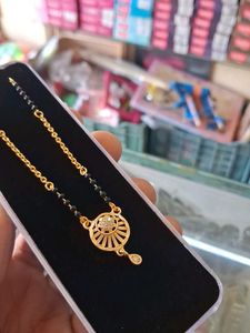 Elegant Gold Chain with Black Beads Pendant