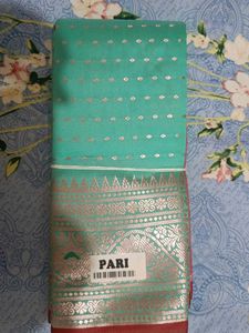 Elegant Teal Saree with Silver Motifs