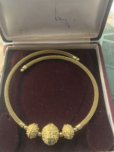 Elegant Gold Necklace with Textured Beads