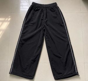 Black Track Pants with White Stripes