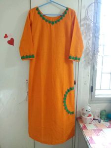 Vibrant Orange Kurta with Green Embroidery