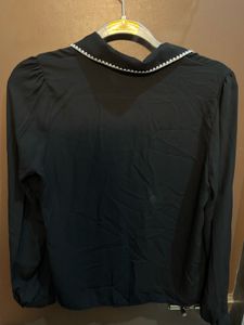 Chic Black Blouse with White Trim