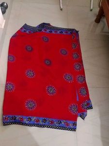 Vibrant Red Saree with Floral Motifs