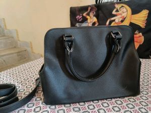 Stylish Black Handbag with Fur Pom-Pom