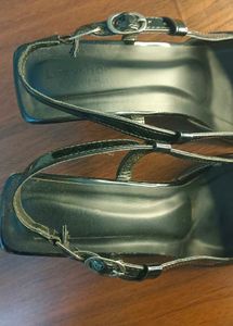Black pointed heels with adjustable band