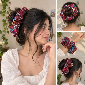 red coloured floral scrunchies