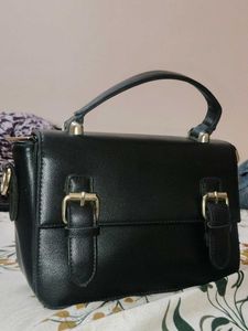 Chic Black Handbag with Buckle Detail