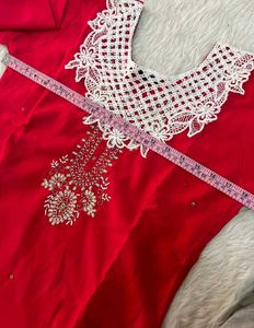 Elegant Red Kurta Set with Intricate White Necklin
