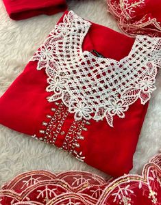 Elegant Red Kurta Set with Intricate White Necklin