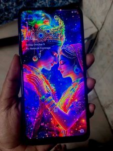 Smartphone with Radha Krishna wallpaper
