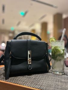 Chic Black Handbag with Gold Accents