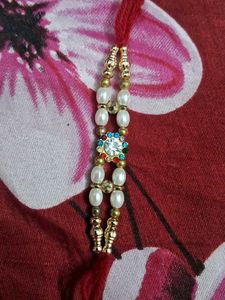 Elegant Rakhi with Pearls and Crystals set of 6 pc