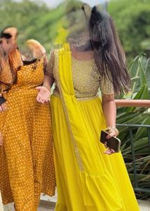 Vibrant Yellow Sequined prestitched Lehenga Choli