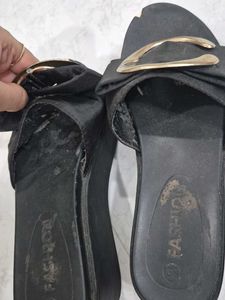 Stylish Black Slip-On Sandals with Gold Accent
