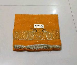Elegant Orange Saree with Peacock Embellishments