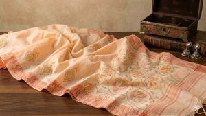 Elegant peach Silk Saree with Pink Border