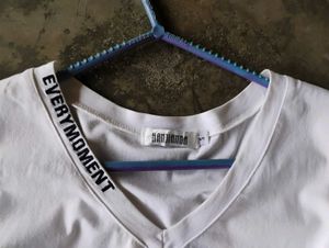 White V-Neck T-Shirt with Text Detail