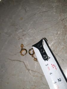 Gold Dangle Earrings with Intricate Design