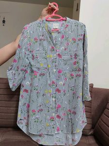 A striped black and white floral shirt.