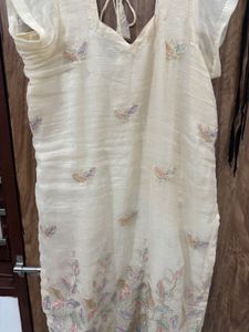 an elegant, cream-toned traditional Indian Kurta