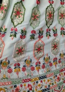 white multi pitch lehenga with f gift
