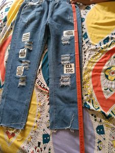 Distressed Blue Denim Jeans