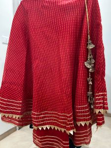 Red lehenga with matching dupatta and golden blous