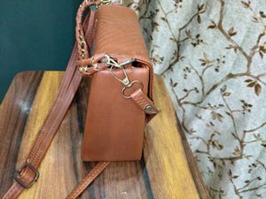 Chic Brown Crossbody Bag with Perforated Design