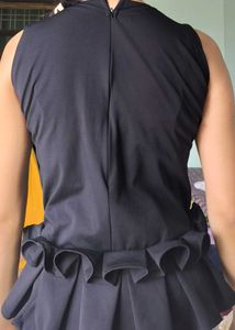 Black Peplum Sleeveless Top Size 34 | Golden Eyele