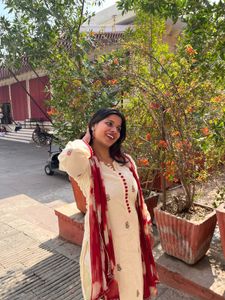 Elegant Cream Kurta with Red Accents