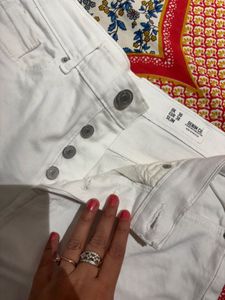 A pair of sexy white distressed shorts