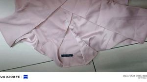 it's a peach pink colour full sleeve, crop shirt