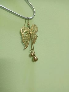 Ribbon Earrings In Gold Shade