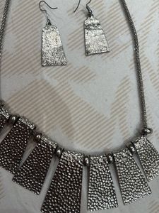 silver neck piece