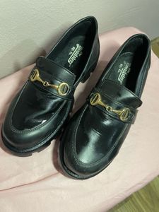 Black leather lofers