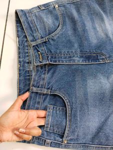 Flared Blue Jeans with Button Detail