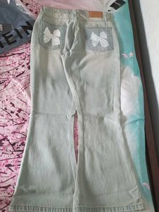 Light Wash Flare Jeans with Bow Detail