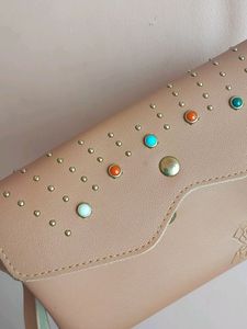 Peach Colour Sling Bag With 2 zips Can Carry Mobile ,wallet Cards And Make Up Items.