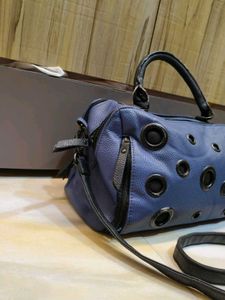 Stylish Blue Handbag with Eyelet Details
