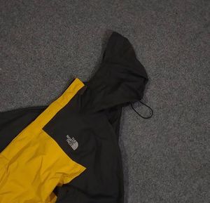 THE NORTH FACE YELLOW AND BLACK JACKET