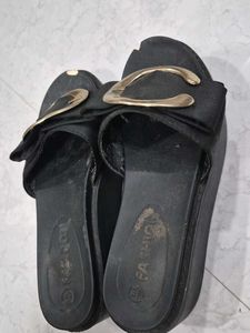 Stylish Black Slip-On Sandals with Gold Accent