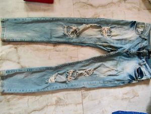 Ripped Light Wash Denim Jeans