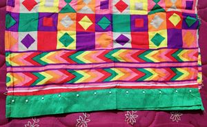 Multi Coloured Cotton Kurti With Pearls Attached On The Neck And Bottom Part.