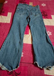Distressed and flared Blue Denim Jeans